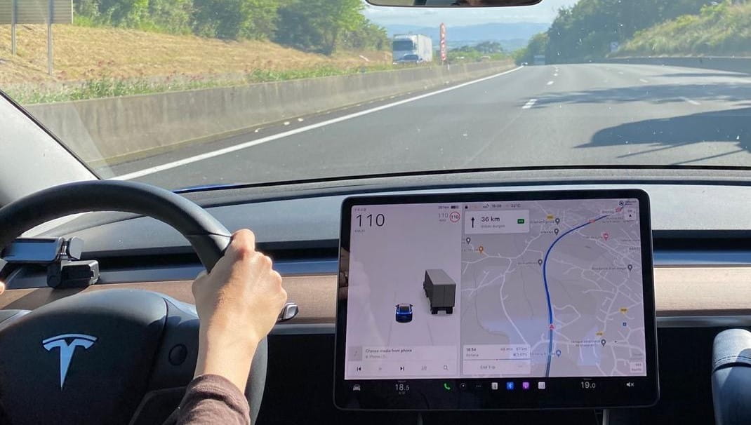 Driving Tesla on highway - cropped
