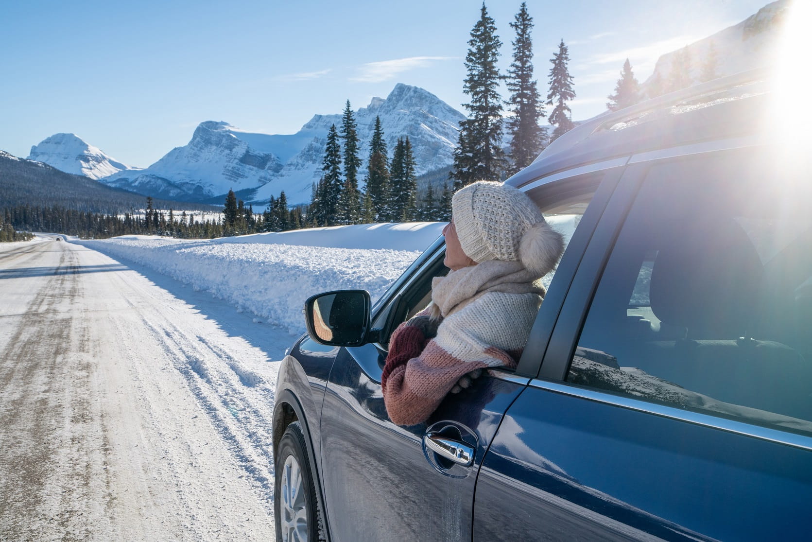 Key visual for the Q4 and full year results 2024, a woman driving a car