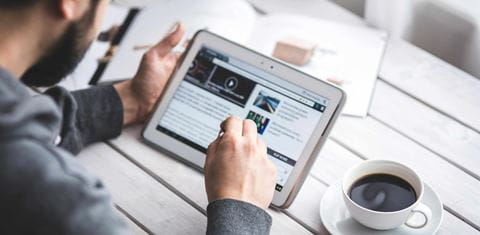 Man browsing on a tablet