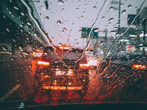 Large-rain-drops-on-vehicle-windshield-1765286