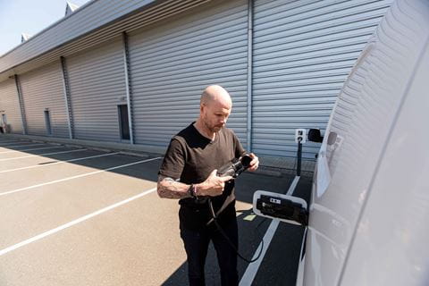 man_connecting_charger_in_van