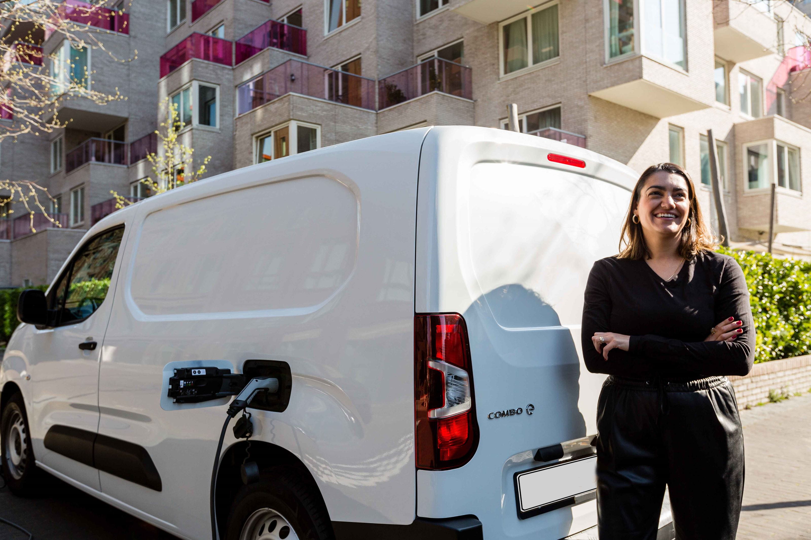 woman_in_front_of_charging_van