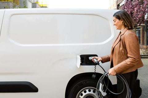 woman_plugging_in_electric_van