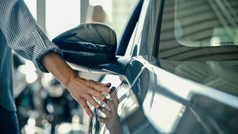 person-touching-car_compressed