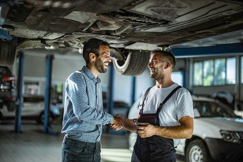 mechanic-shaking-hand-with-customer_compressed