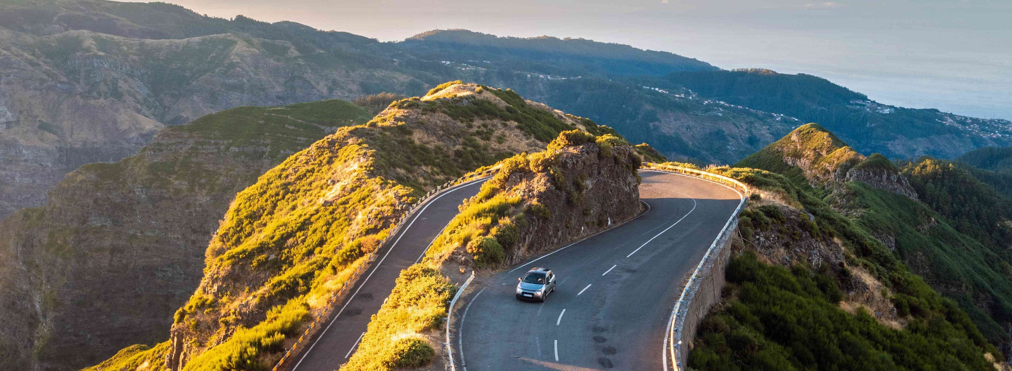 Car driving over a mountain