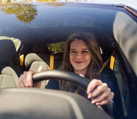 Woman driving Polestar 2