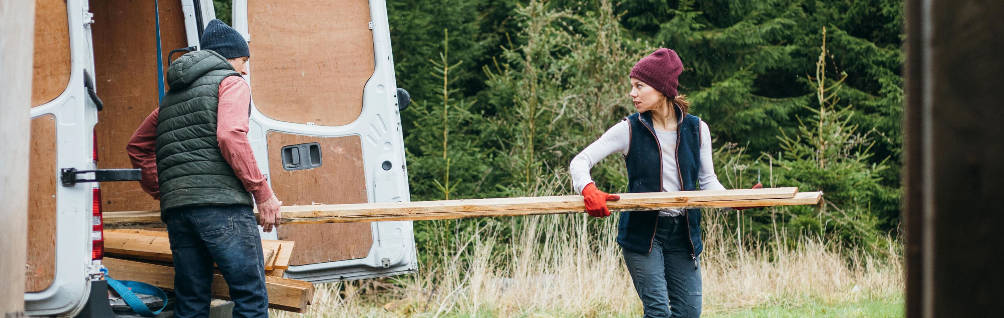 Hero-lady-carrying-wood-out-lcv