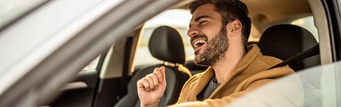 Hero-man-singing-inside-car
