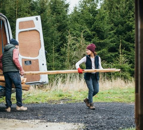 zipper-lady-carrying-wood-out-from-LCV