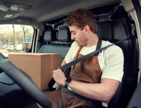 Man sitting in a van