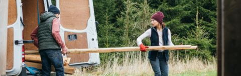 Hero-lady-carrying-wood-out-lcv